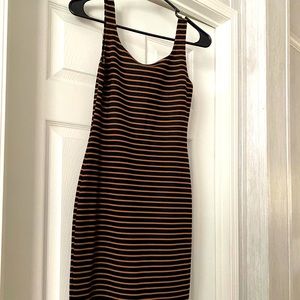 Small stripped black and cream/tan color .. has a little slice in the back